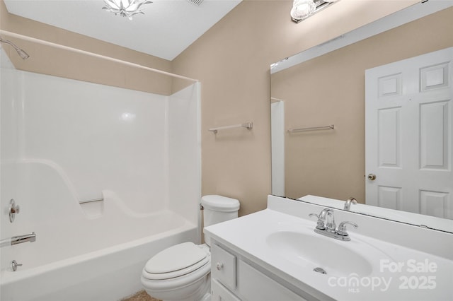 bathroom with vanity, toilet, and shower / washtub combination
