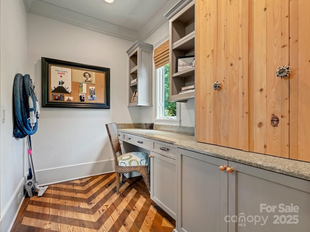 office featuring baseboards and crown molding