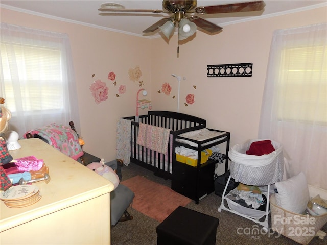 bedroom featuring crown molding and ceiling fan