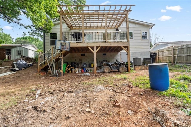 back of property with a deck, central AC, fence, a pergola, and stairs