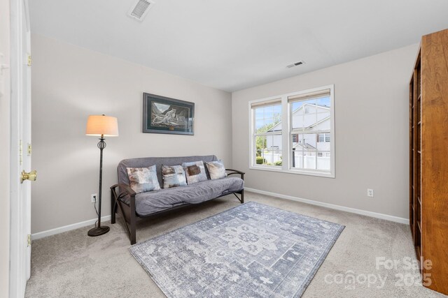 sitting room featuring carpet floors, baseboards, and visible vents