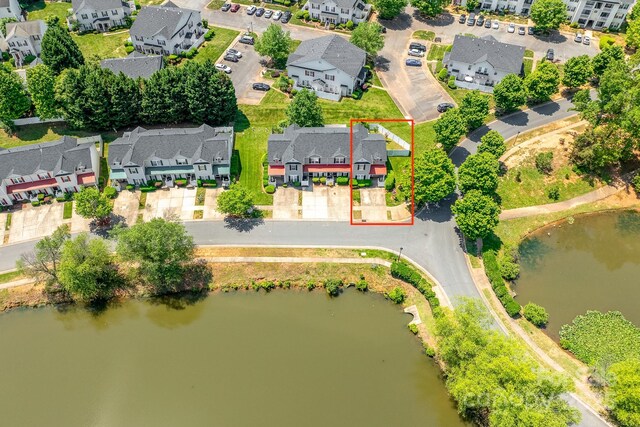 aerial view featuring a water view and a residential view