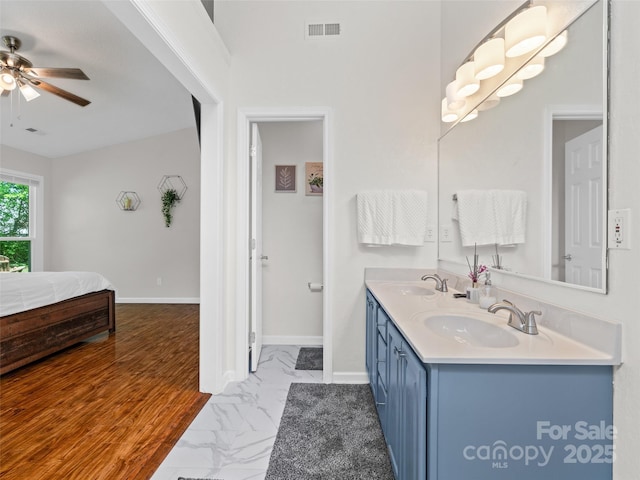 full bathroom featuring a ceiling fan, visible vents, a sink, and marble finish floor