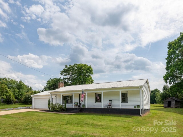 2054 Hickory Hills Dr, Denver, NC 28037 - view of front of property featuring a porch, concrete driveway, a front lawn, metal roof, and a chimney