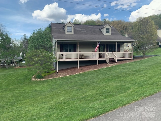 107 Buckner Dr, Roan Mountain, TN 37687 - view of front of house with a porch and a front lawn