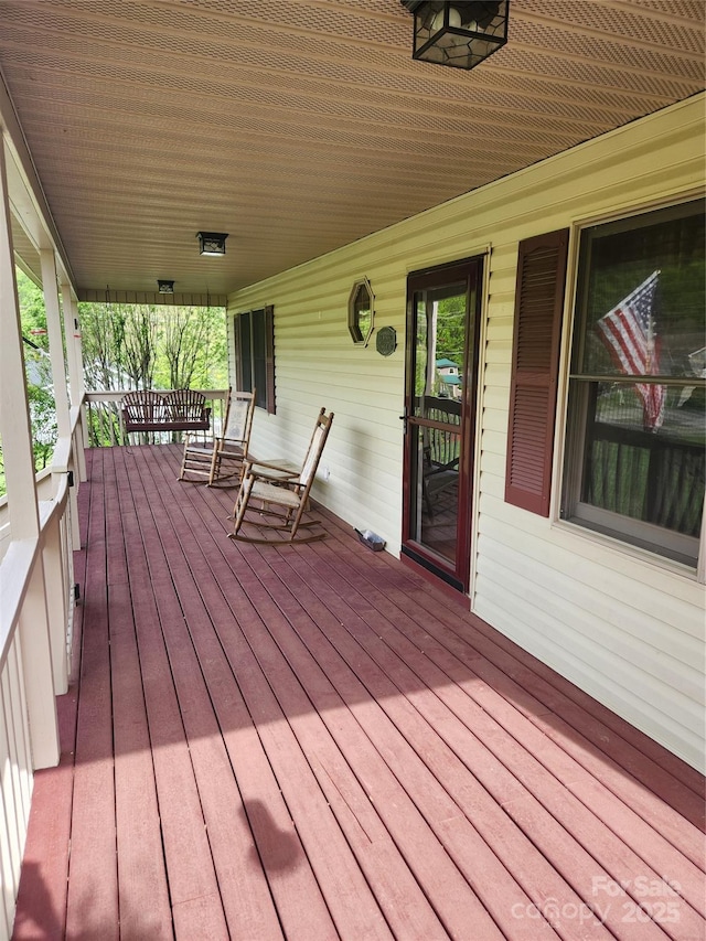 107 Buckner Dr, Roan Mountain, TN 37687 - wooden terrace featuring covered porch