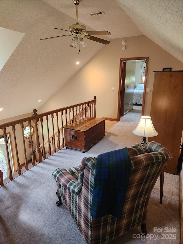 107 Buckner Dr, Roan Mountain, TN 37687 - carpeted living room featuring a textured ceiling, a ceiling fan, baseboards, lofted ceiling, and visible vents