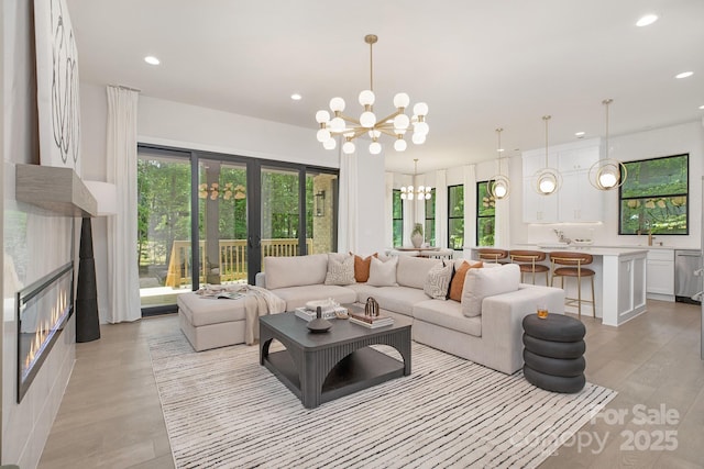 1534 Easy St, Belmont, NC 28012 - living room featuring a chandelier, recessed lighting, and light wood finished floors
