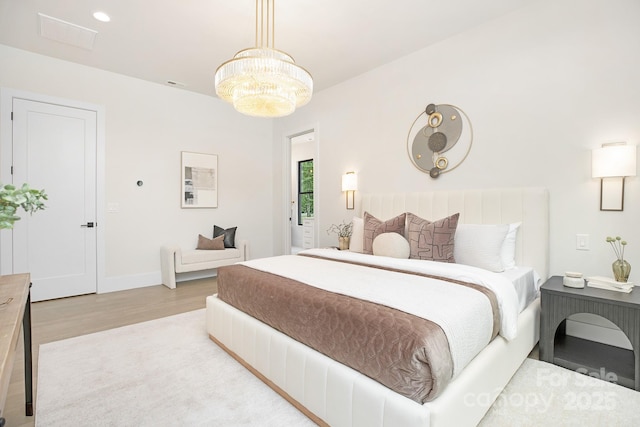 1534 Easy St, Belmont, NC 28012 - bedroom featuring wood finished floors, a chandelier, and baseboards