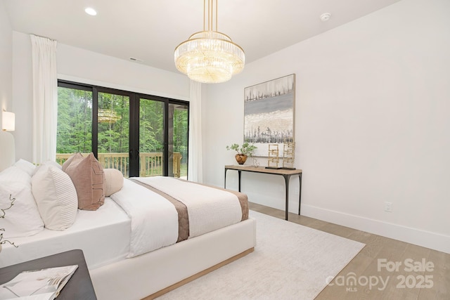 1534 Easy St, Belmont, NC 28012 - bedroom featuring wood finished floors, baseboards, a chandelier, and recessed lighting