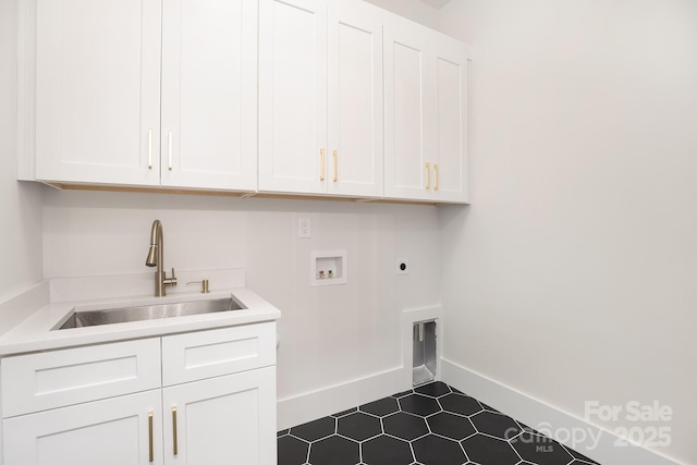 1534 Easy St, Belmont, NC 28012 - washroom with cabinet space, hookup for an electric dryer, washer hookup, dark tile patterned flooring, and baseboards