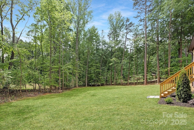 1534 Easy St, Belmont, NC 28012 - view of green lawn featuring stairway and a wooded view