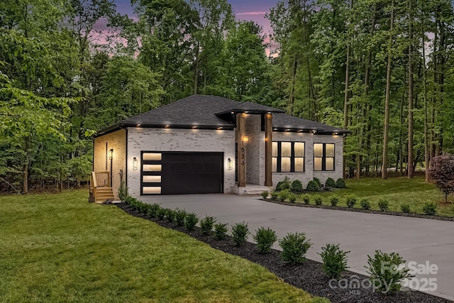 1534 Easy St, Belmont, NC 28012 - view of front of house with concrete driveway, brick siding, a front lawn, a garage, and a shingled roof