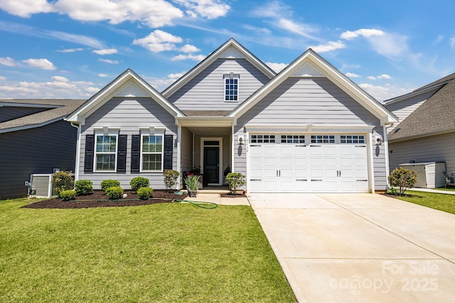 5112 Larewood Dr, Charlotte, NC 28215 - view of front of home featuring concrete driveway, a front yard, and a garage