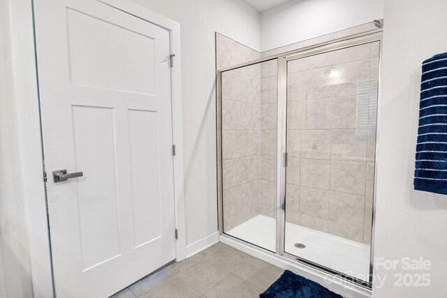 5112 Larewood Dr, Charlotte, NC 28215 - full bathroom featuring tile patterned floors, baseboards, and a shower stall