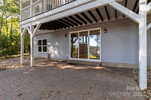 view of patio featuring a balcony