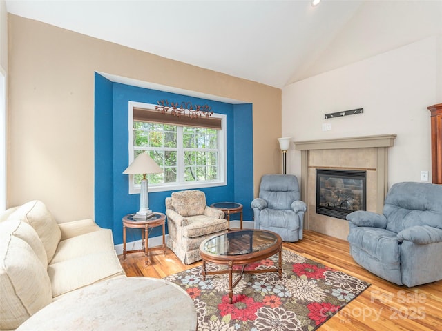 54 Sapling Ln, Waynesville, NC 28786 - living room with lofted ceiling, a tiled fireplace, wood finished floors, baseboards, and recessed lighting