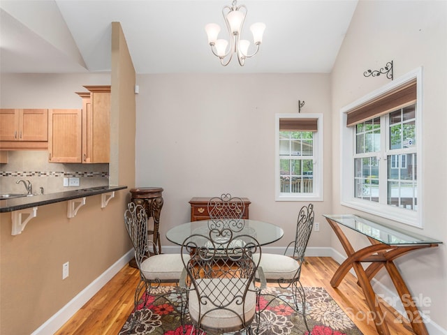 54 Sapling Ln, Waynesville, NC 28786 - dining room featuring light wood-type flooring, baseboards, and a chandelier