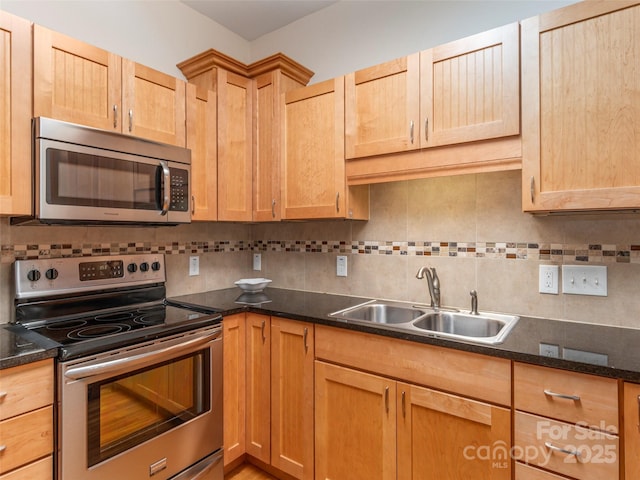 54 Sapling Ln, Waynesville, NC 28786 - kitchen with appliances with stainless steel finishes, a sink, and decorative backsplash