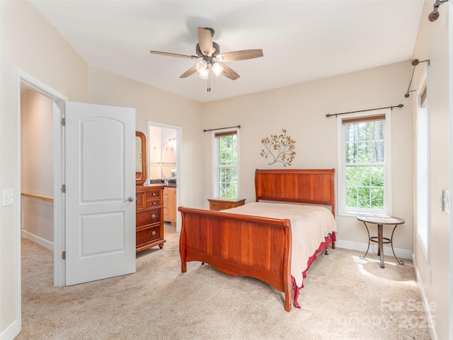 54 Sapling Ln, Waynesville, NC 28786 - bedroom featuring light colored carpet, baseboards, a ceiling fan, and ensuite bathroom
