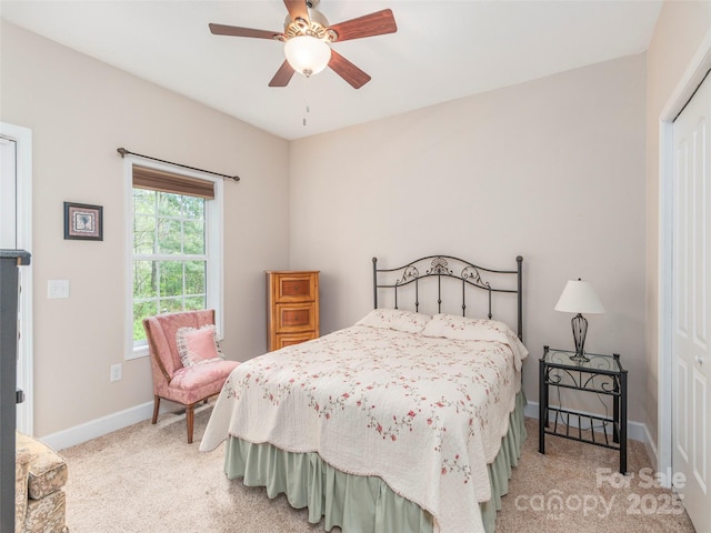 54 Sapling Ln, Waynesville, NC 28786 - bedroom with light carpet, baseboards, a closet, and a ceiling fan