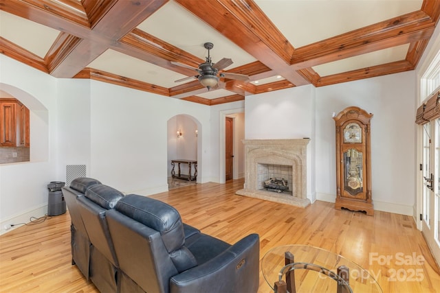 277 Tradition Dr, Mount Gilead, NC 27306 - living area with beamed ceiling, arched walkways, a ceiling fan, and coffered ceiling
