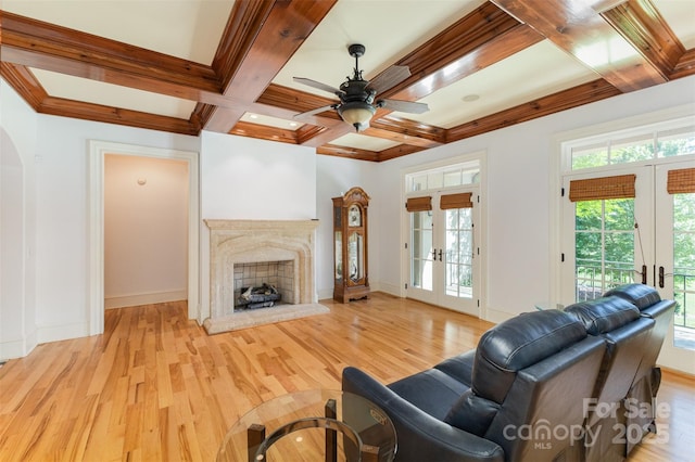 277 Tradition Dr, Mount Gilead, NC 27306 - living room featuring wood finished floors, beam ceiling, french doors, a ceiling fan, and coffered ceiling
