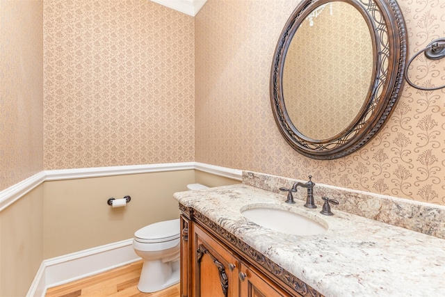 277 Tradition Dr, Mount Gilead, NC 27306 - half bathroom featuring wood finished floors, toilet, and wallpapered walls