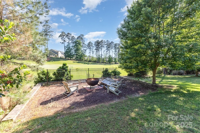 277 Tradition Dr, Mount Gilead, NC 27306 - view of yard with an outdoor fire pit and fence