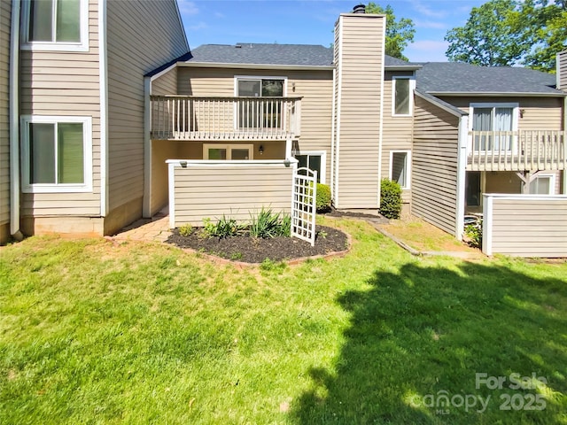 3143 Windbluff Dr, Charlotte, NC 28277 - back of property with a chimney, a yard, and a balcony
