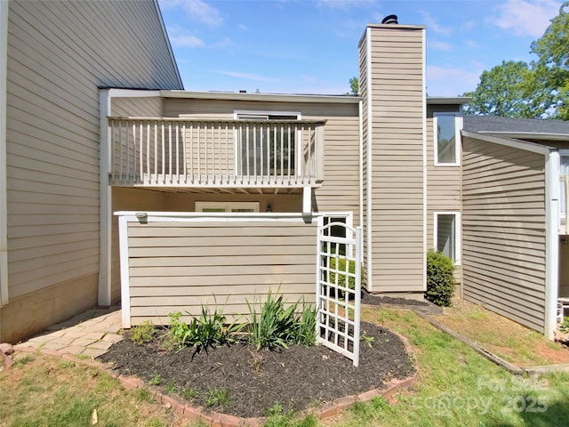 3143 Windbluff Dr, Charlotte, NC 28277 - rear view of house with a chimney