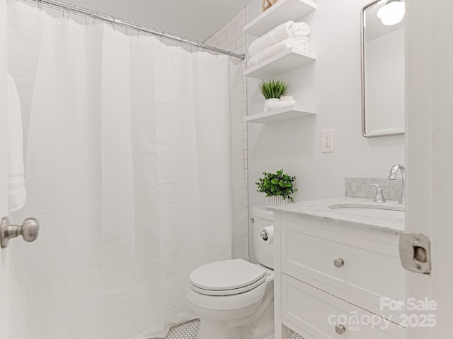 bathroom featuring toilet, vanity, tile patterned flooring, and a shower with shower curtain