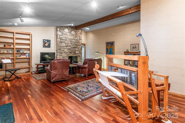 461 Sugar Hollow Rd, Fairview, NC 28730 - living area with wood finished floors, a textured ceiling, and rail lighting