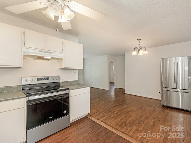 kitchen with ceiling fan with notable chandelier, under cabinet range hood, white cabinetry, dark wood-style floors, and appliances with stainless steel finishes