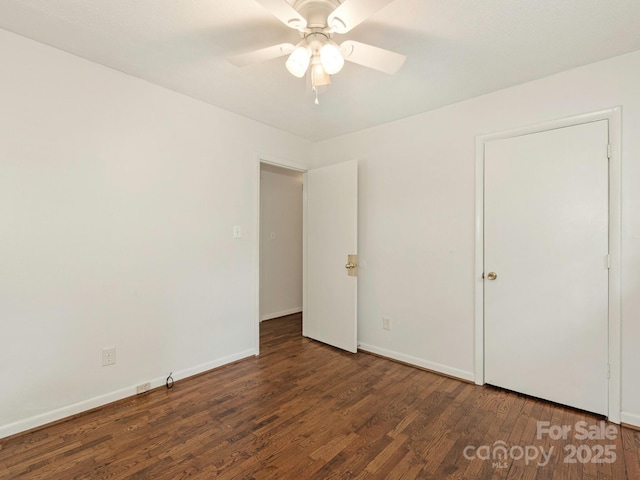 unfurnished bedroom featuring baseboards, ceiling fan, and wood finished floors