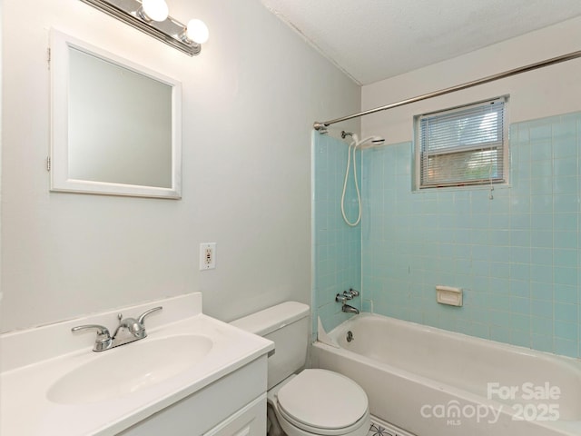 bathroom with toilet, washtub / shower combination, and vanity