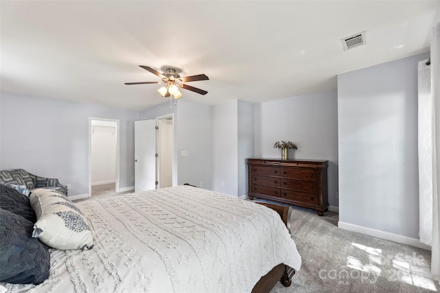 bedroom with baseboards, light carpet, and ceiling fan