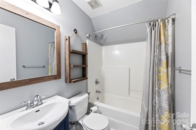 full bath with shower / tub combo with curtain, toilet, and vanity