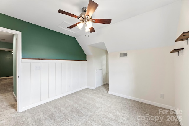 bonus room featuring carpet flooring, a ceiling fan, vaulted ceiling, and baseboards