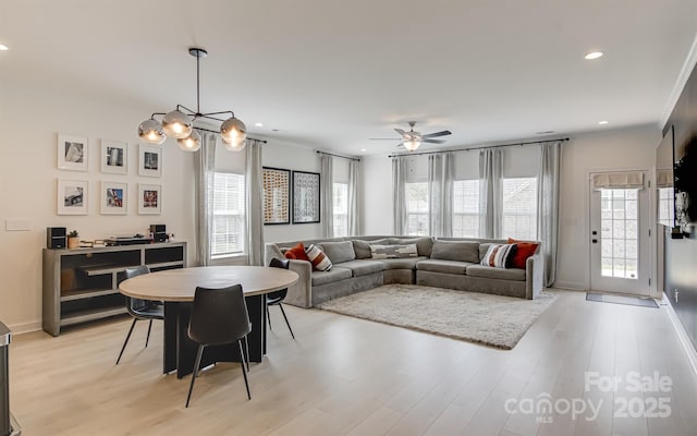 living area featuring light wood-type flooring, recessed lighting, baseboards, and a ceiling fan