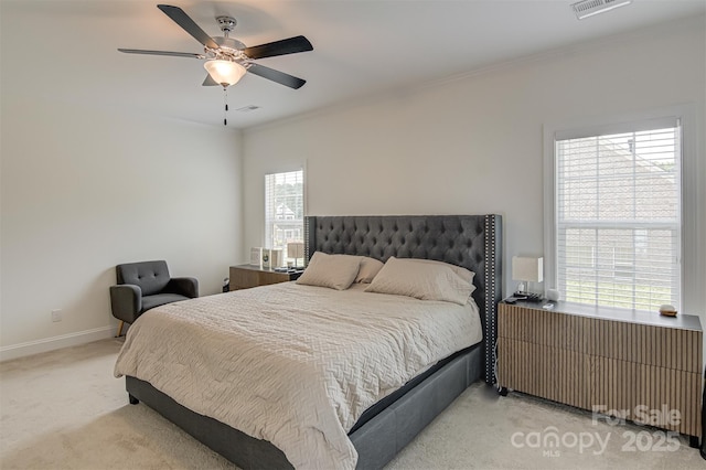 bedroom with radiator heating unit, baseboards, light carpet, and visible vents