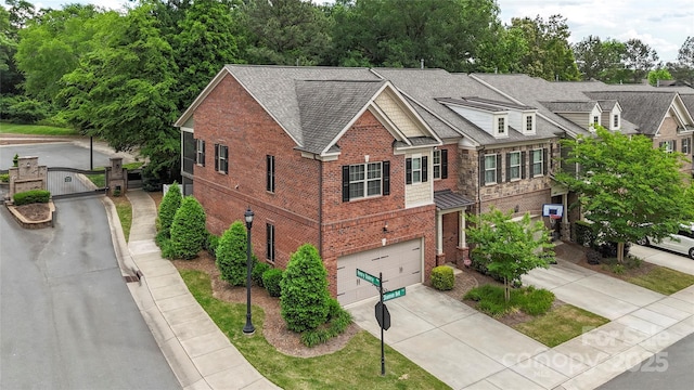 5422 Shannon Bell Ln, Charlotte, NC 28277 - view of front of house featuring brick siding, driveway, roof with shingles, and a garage