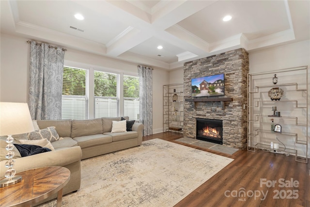 5422 Shannon Bell Ln, Charlotte, NC 28277 - living area with wood finished floors, a stone fireplace, beamed ceiling, ornamental molding, and recessed lighting