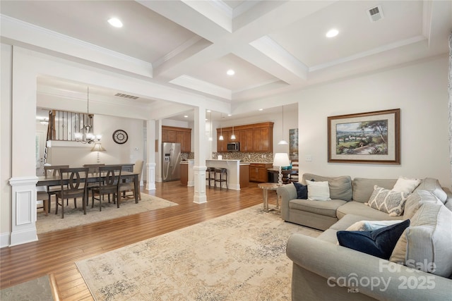 5422 Shannon Bell Ln, Charlotte, NC 28277 - living area with a chandelier, beam ceiling, light wood-type flooring, recessed lighting, and crown molding