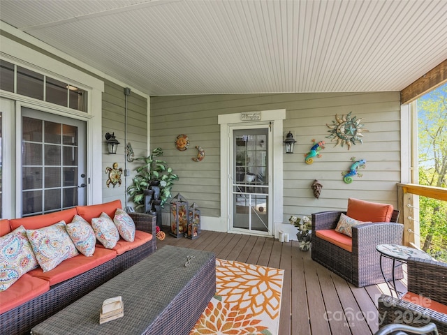 wooden terrace featuring outdoor lounge area
