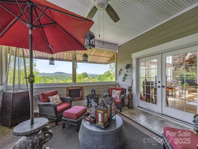 view of patio featuring a ceiling fan, french doors, and an outdoor hangout area