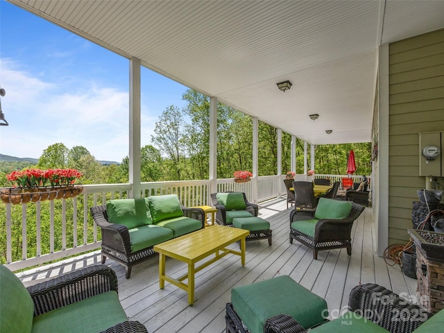 wooden deck featuring outdoor lounge area