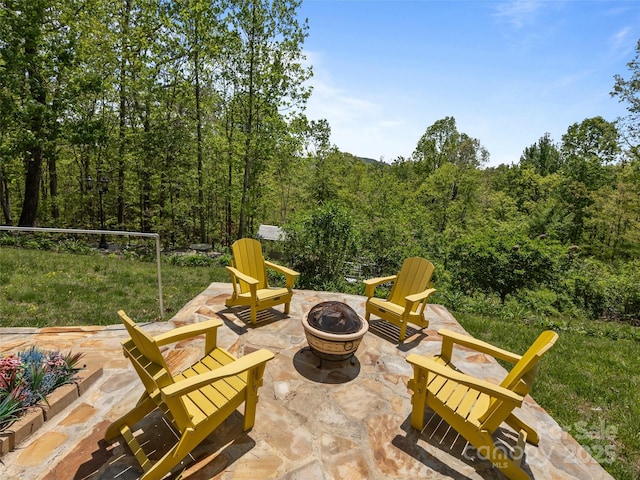 view of patio / terrace with an outdoor fire pit