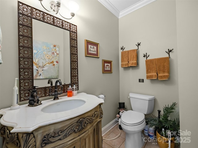 half bathroom featuring crown molding, vanity, toilet, baseboards, and tile patterned floors