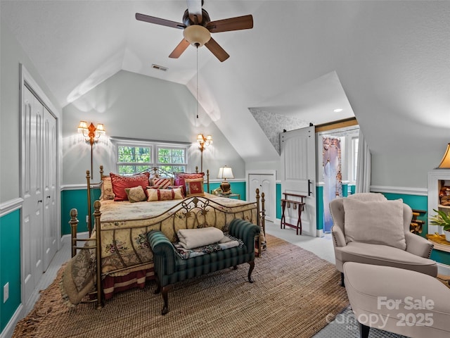 carpeted bedroom with access to exterior, a ceiling fan, vaulted ceiling, visible vents, and a closet